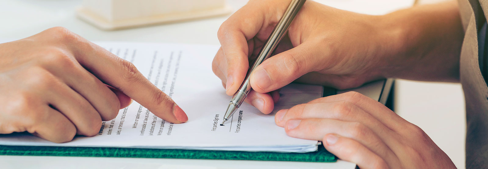 Person signing forms.